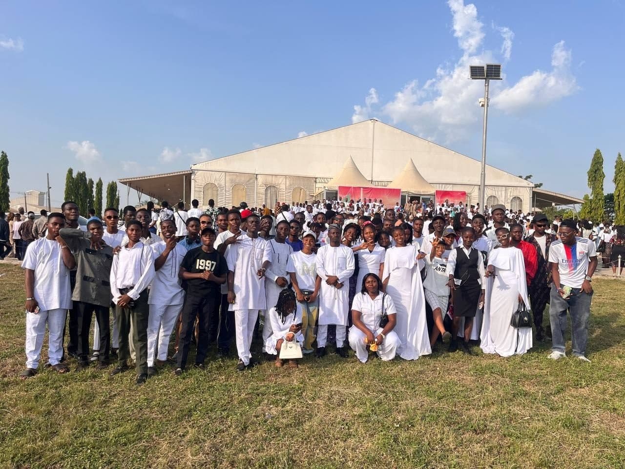 Accelerator Community members dressed in white at a community gathering
